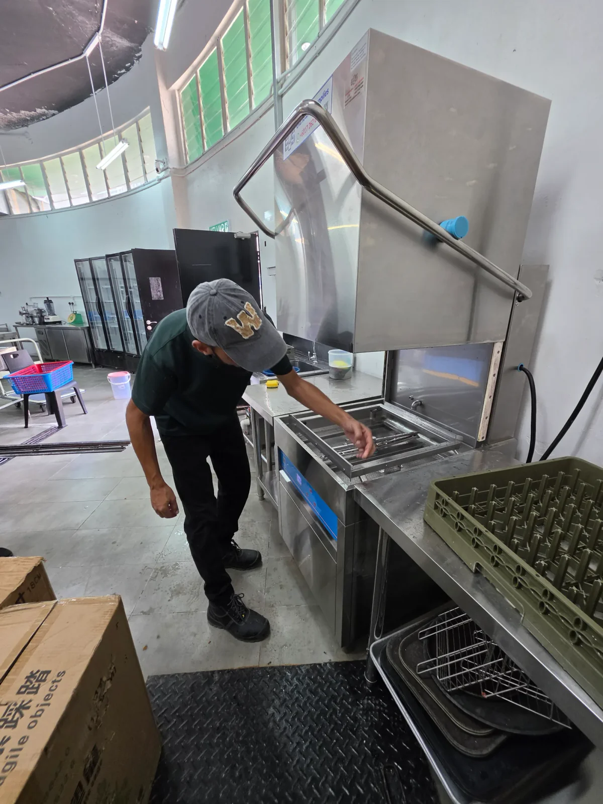 An EHS technician providing readily available spare parts to keep your dishwasher running efficiently.