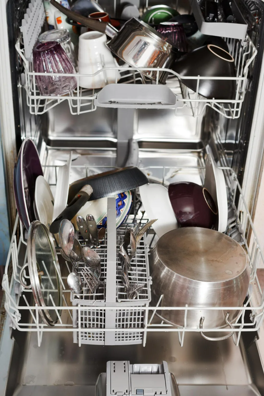 Overloading the dishwasher can prevent dishes from being cleaned properly.